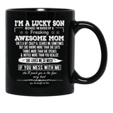I'M A Lucky Son Because I'M Raised By A Freaking Awesome Mom (4) Black Coffee Mug - Black